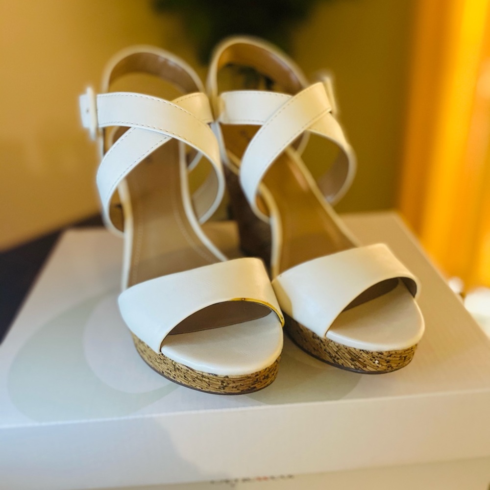 Women’s white wedges.